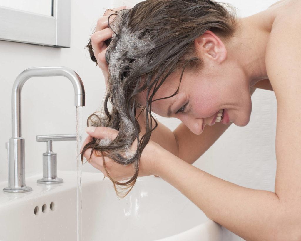 woman washing hair 1 e1580989390458